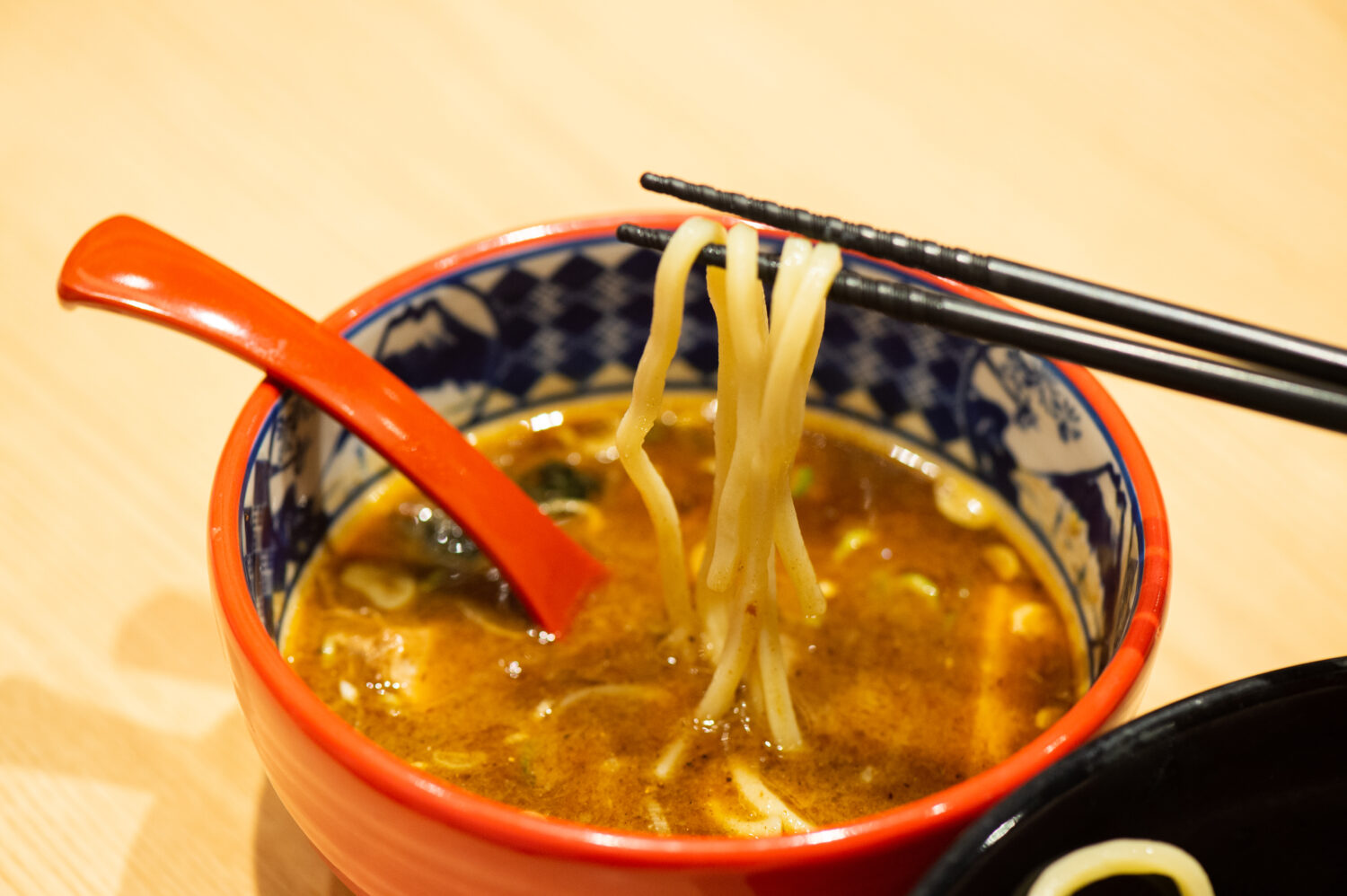 Dip noodles into the soup, and slurp