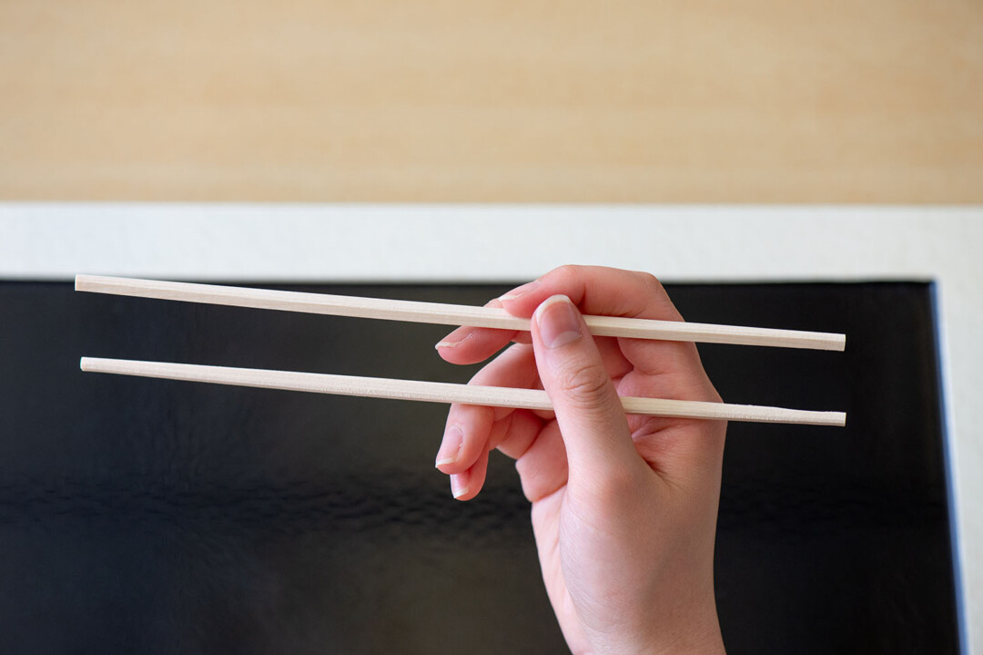The correct way to hold chopsticks